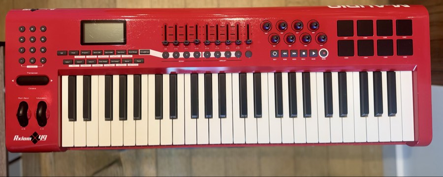 Red Axiom 49 MIDI keyboard controller with pads and knobs