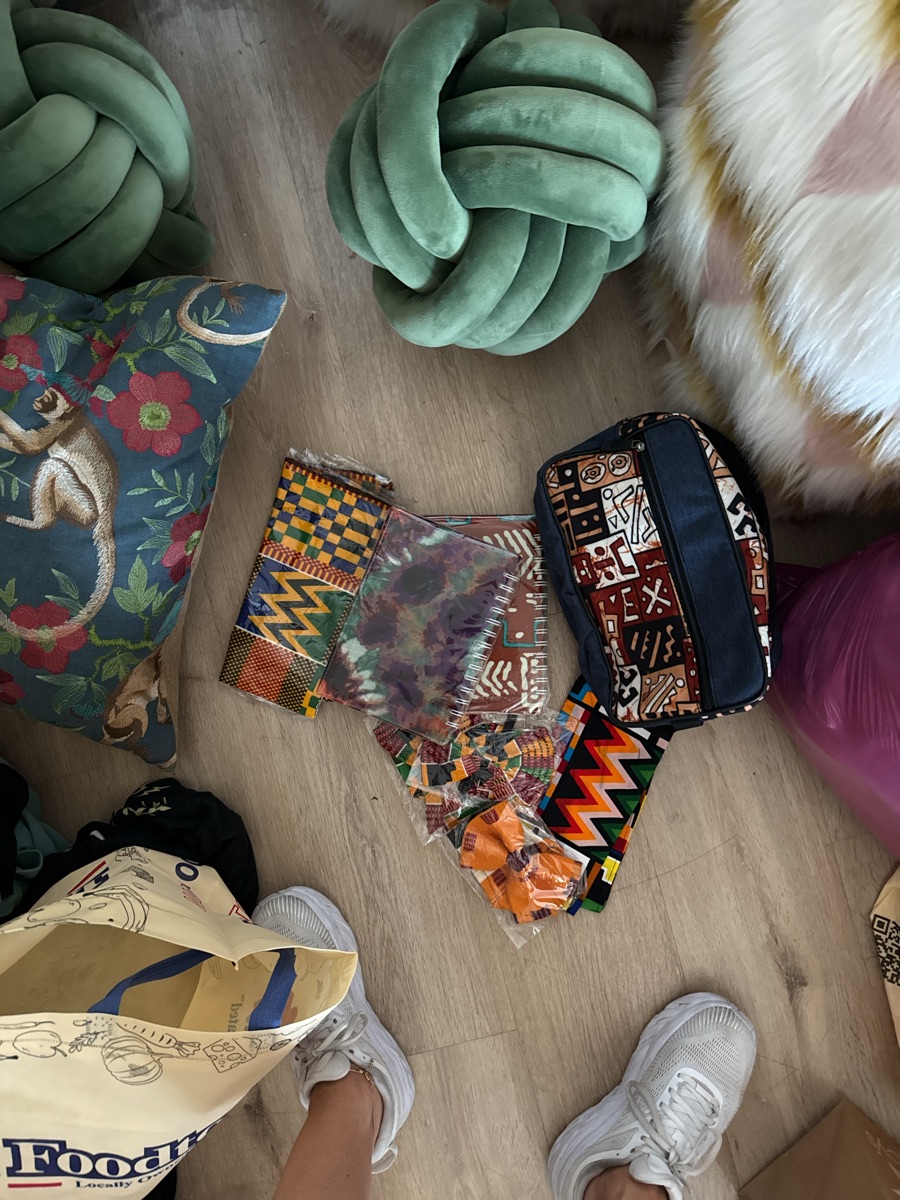 African wedding gifts - two notebooks, bow ties, toiletry bag, scarves