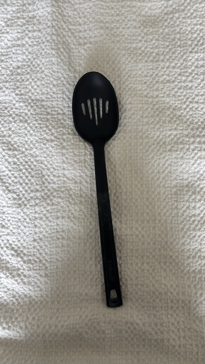 Slotted cooking spoon