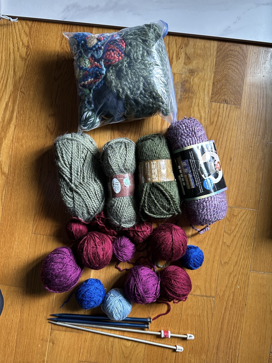 Assorted yarn and knitting needles