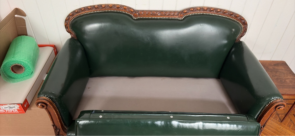 Vintage leather loveseat with carved swan legs