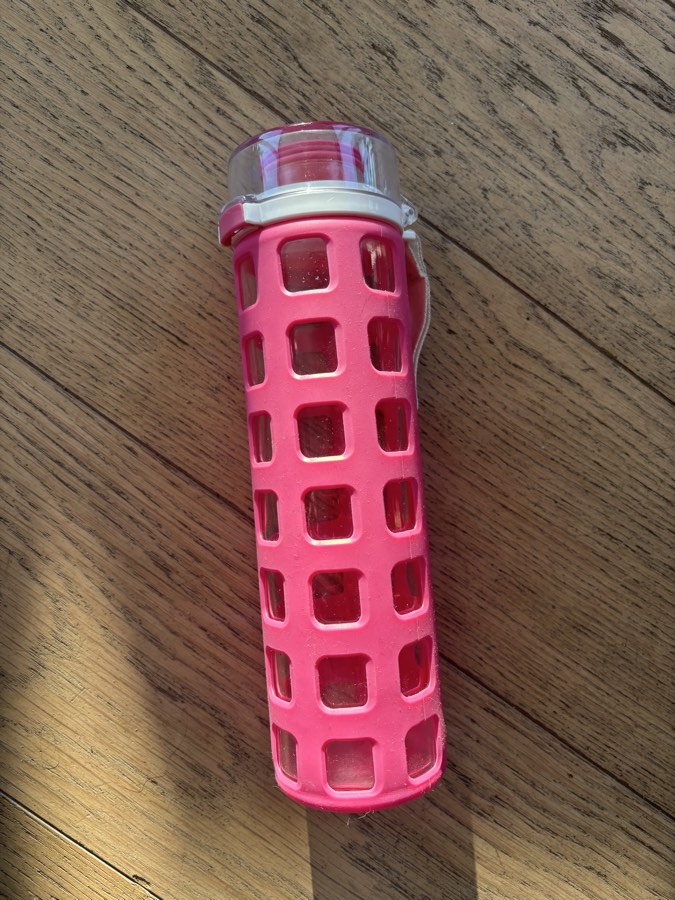 Glass water bottle with silicone sleeve
